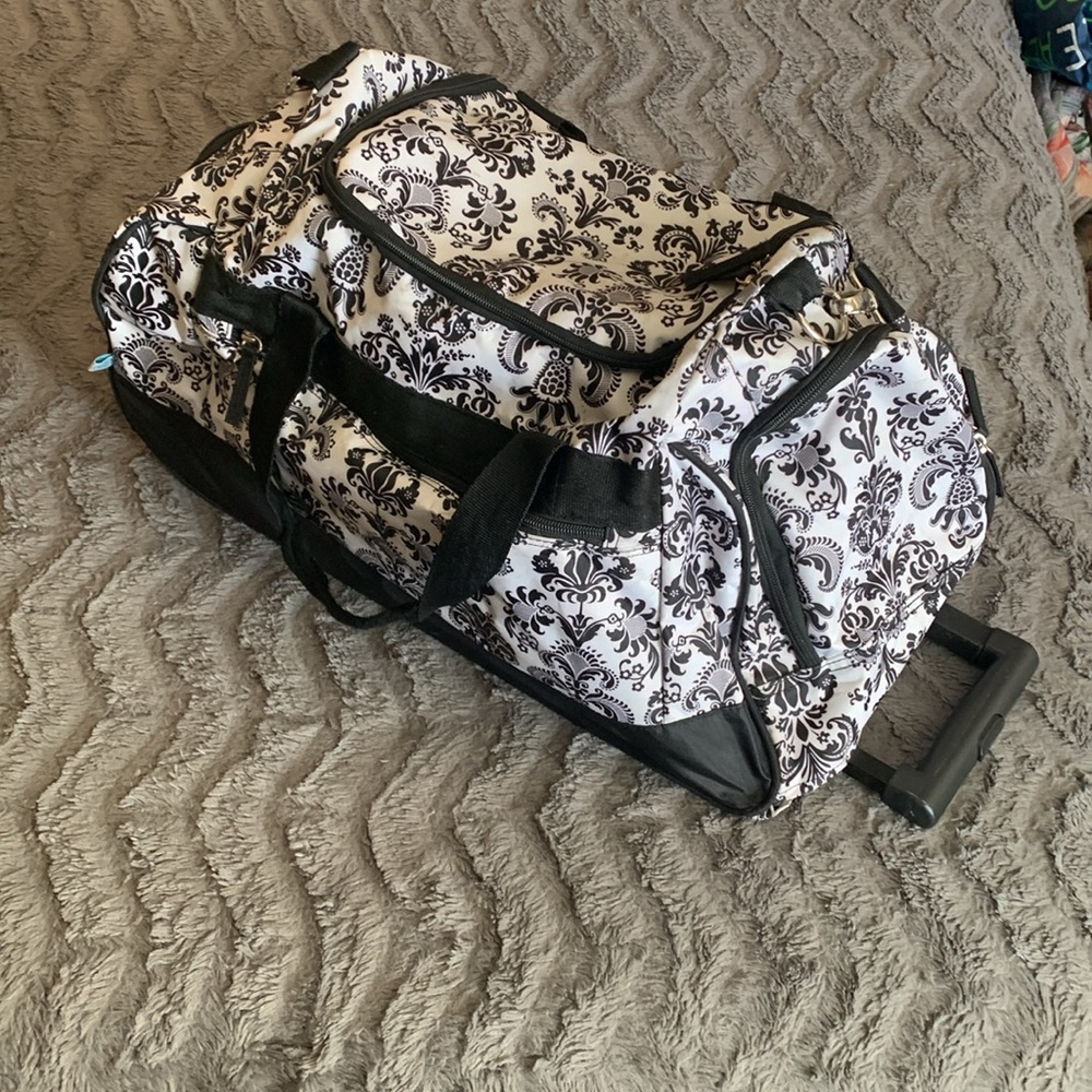 Fleur De Lis black and white duffel bag with wheels